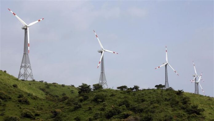 Power-generating windmill turbines are pictured in Suzlon wind farm at Sanodar village